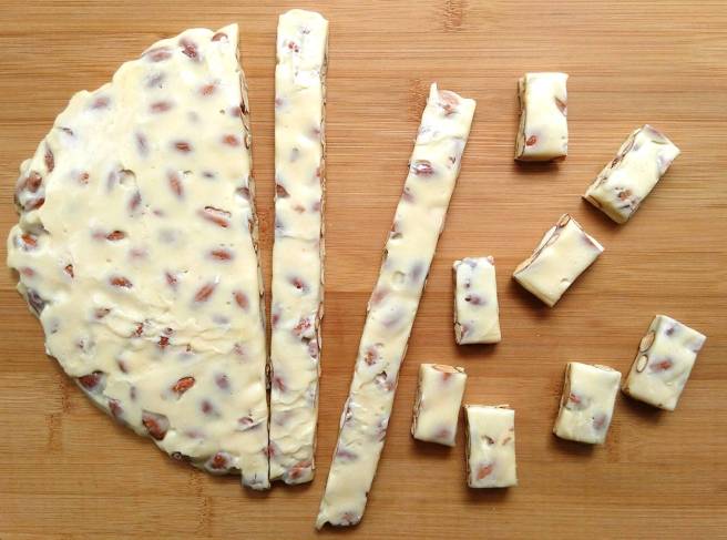 cutting milk nougat candy into pieces